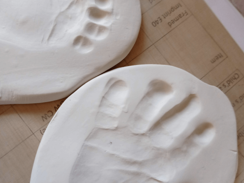 Clay imprint of small feet 